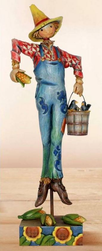   shore heartwood creek scaring up fun scarecrow with a bucket figurine